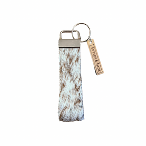 Tan and white cow hide key chain